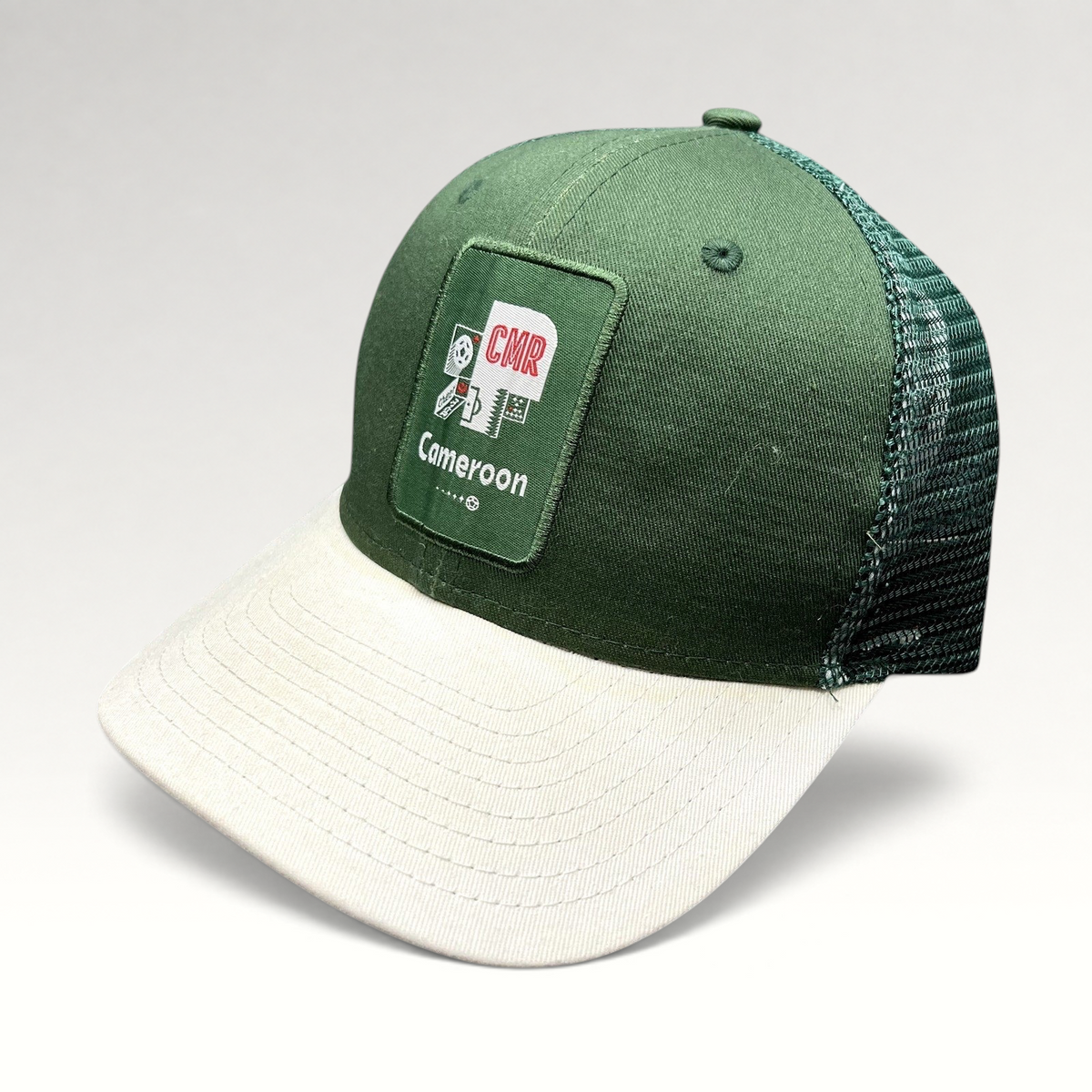 Raree Finds FIFA World Cup Qatar 2022 Cameroon CMR snapback trucker hat with green crown, white brim, and mesh back.