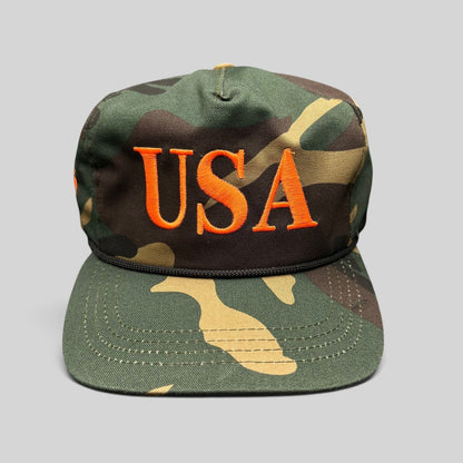Raree Finds woodland camo snapback hat with orange USA embroidery and black rope detail on the brim