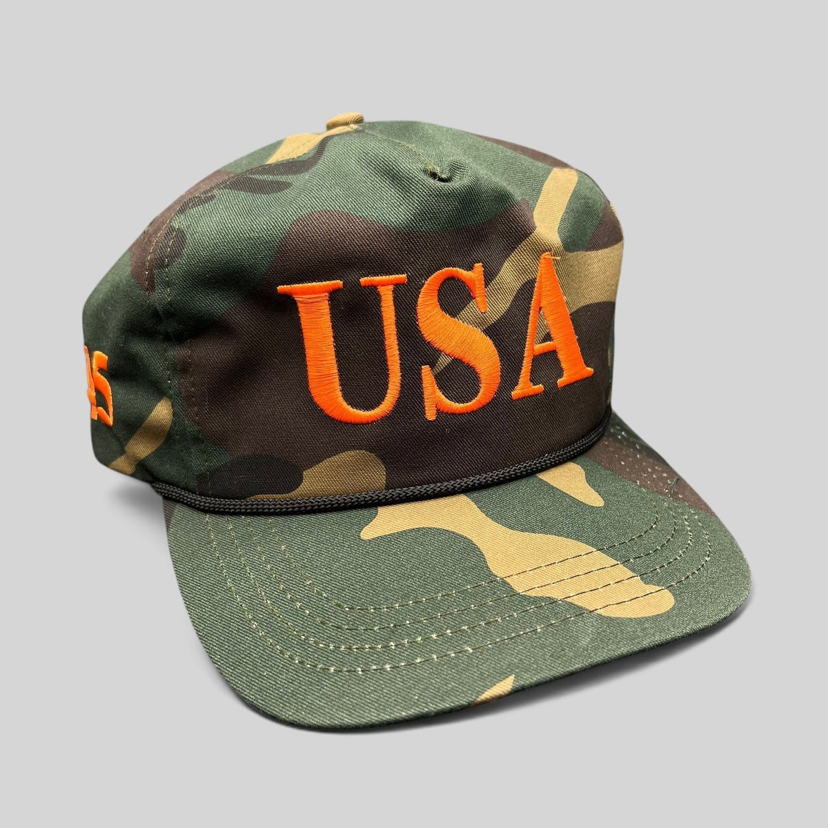 Raree Finds woodland camo snapback hat with bold orange USA embroidery and black rope detail on the brim.