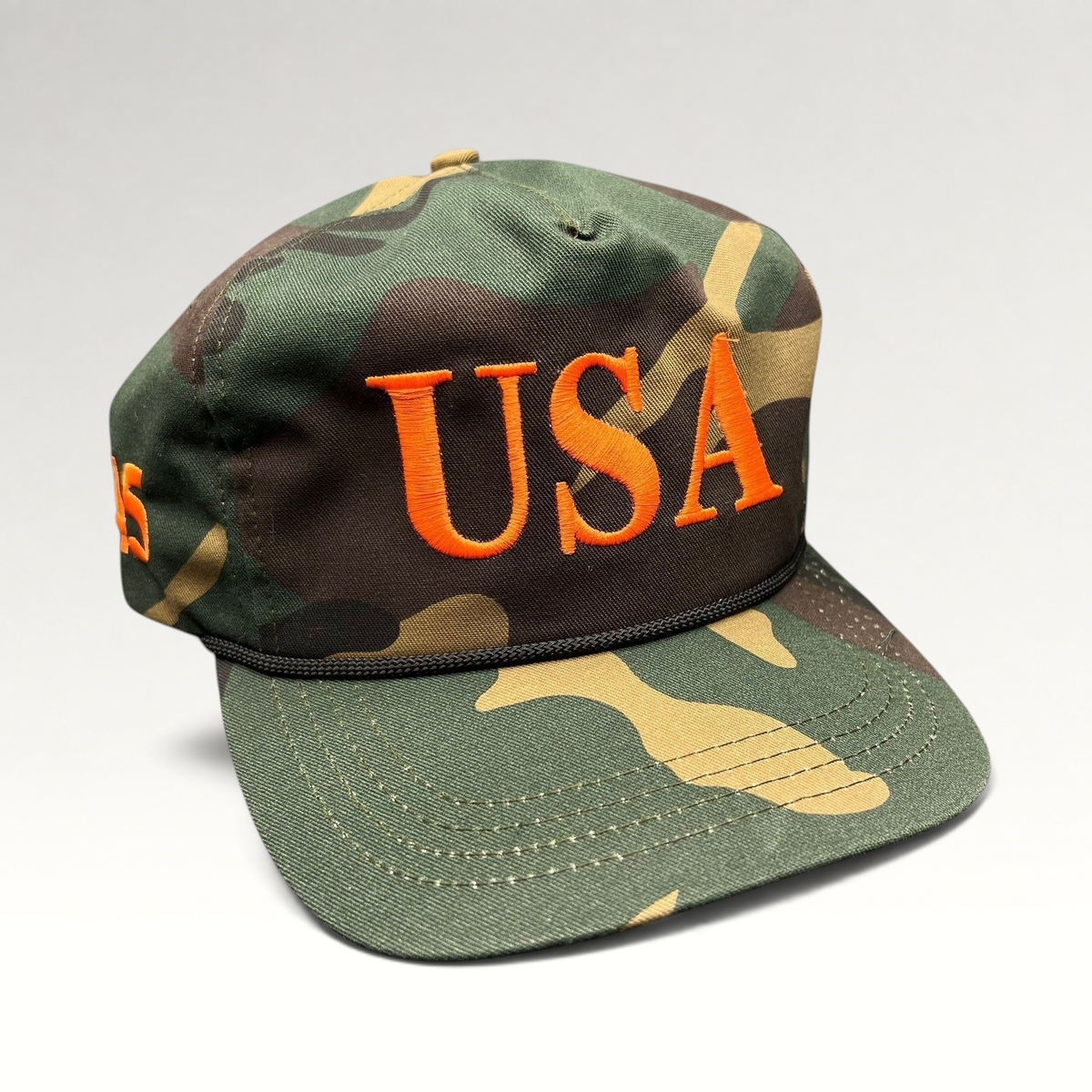 Raree Finds woodland camo snapback hat with bold orange USA embroidery and black rope detail on the brim.