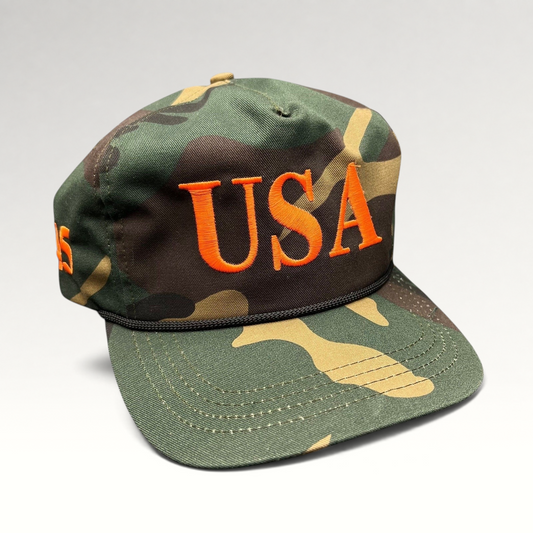 Raree Finds woodland camo snapback hat with bold orange USA embroidery and black rope detail on the brim.