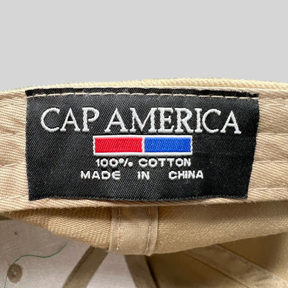 Raree Finds vintage Cap America hat interior label showing 100 percent cotton material and brand logo on beige fabric