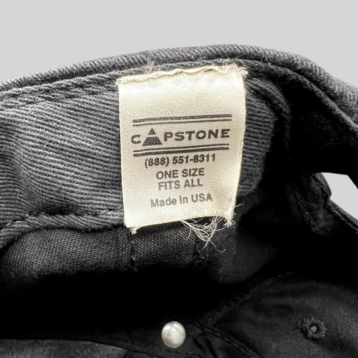 Raree Finds vintage Capstone hat interior tag showing Made in USA and one size fits all details