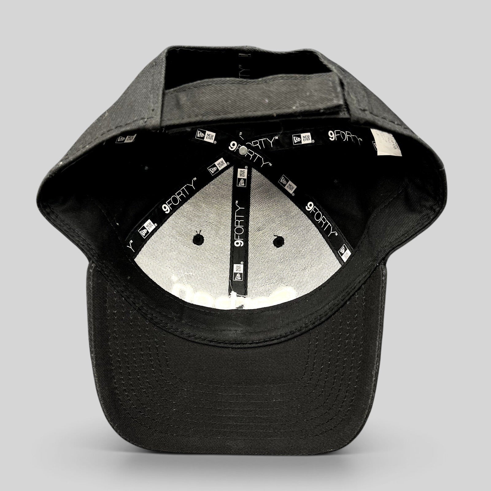 Raree Finds Carbon 3D Printing New Era 9FORTY black cotton strapback hat showing interior branding and adjustable strap