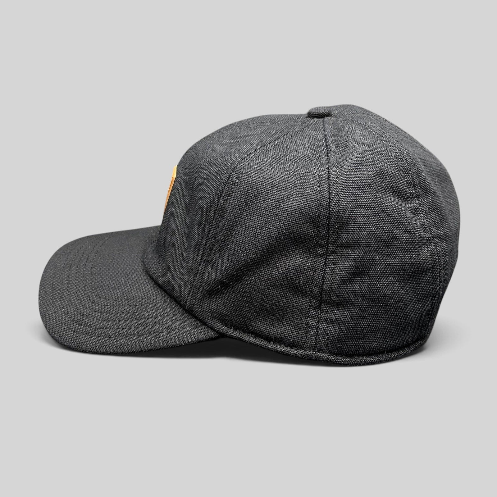 Raree Finds Carhartt black duck canvas ear flap cap with structured crown and side profile view