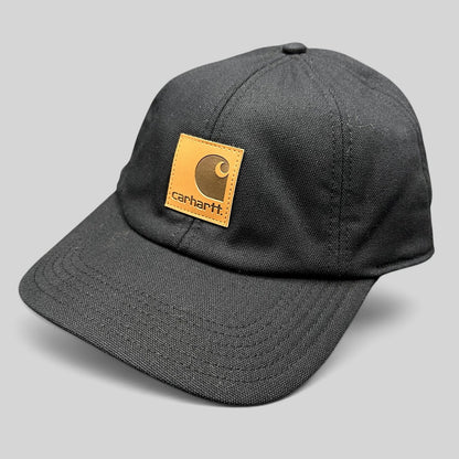 Raree Finds Carhartt black duck canvas workwear cap with a tan square logo patch on the front crown