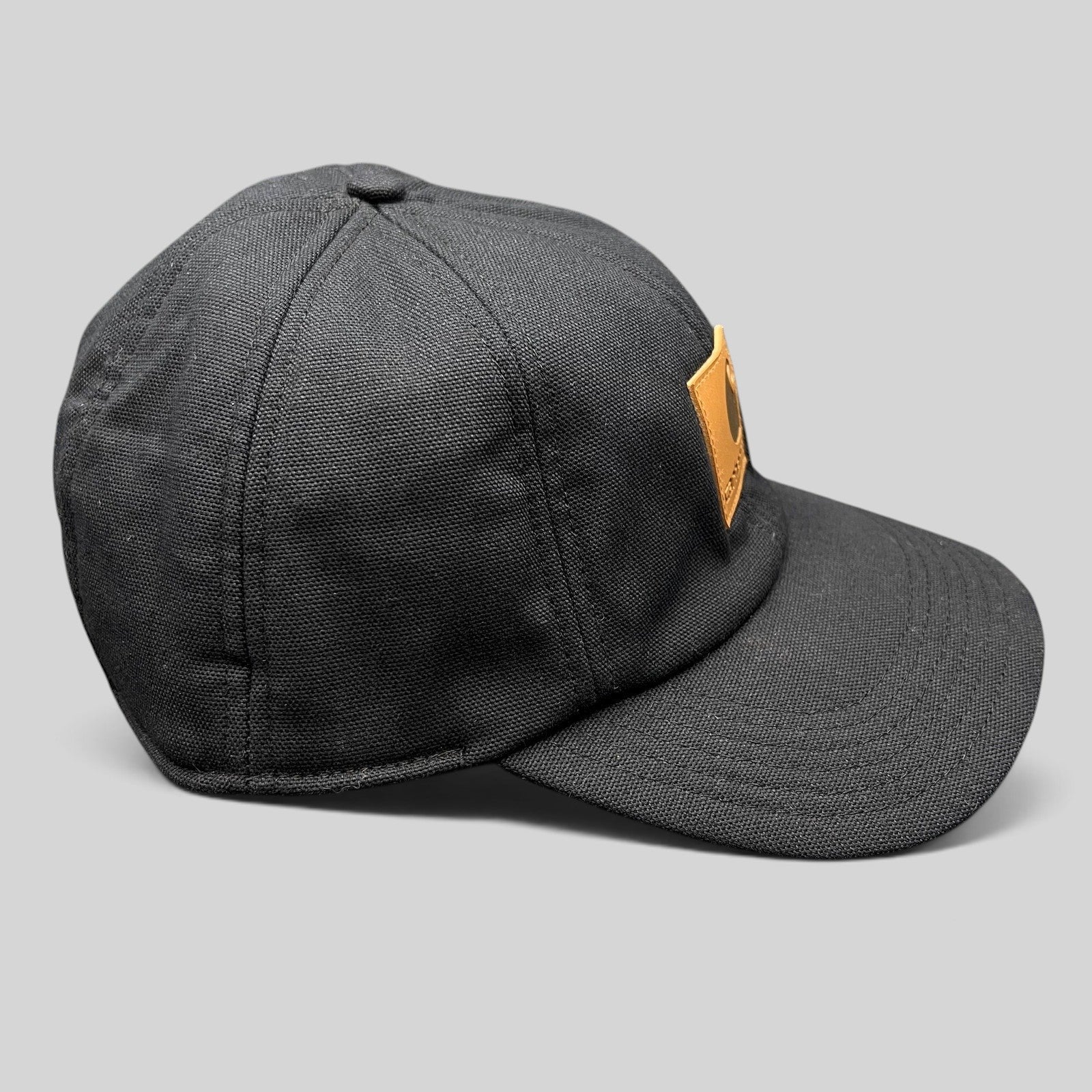 Raree Finds Carhartt black duck canvas workwear cap with a structured crown and tan logo patch on the front