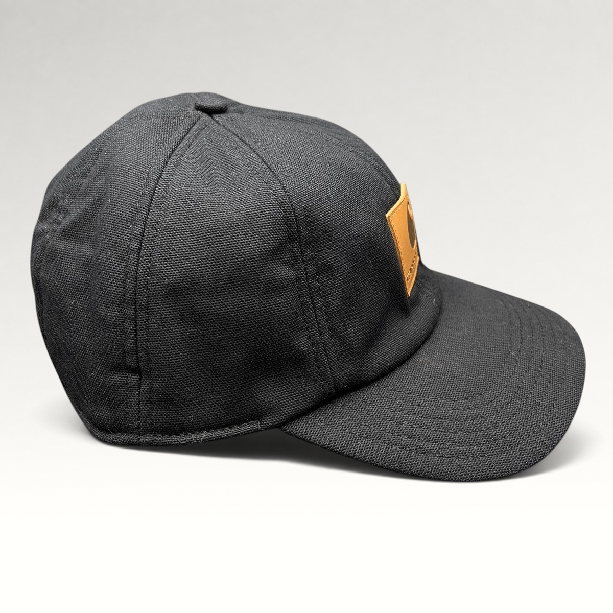 Raree Finds Carhartt black duck canvas workwear cap with a structured crown and tan logo patch on the front