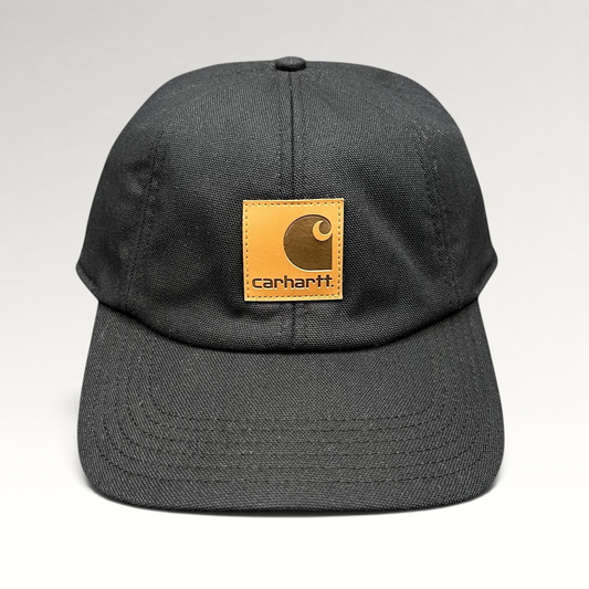 Raree Finds Carhartt black duck canvas workwear cap with a square logo patch and fold-down ear warmers.
