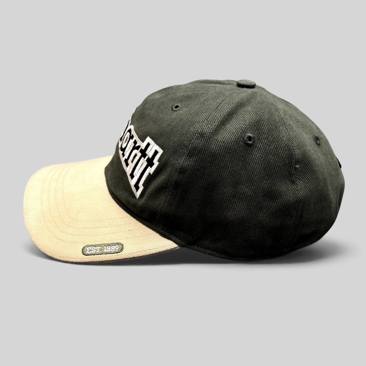 Raree Finds Carhartt two-tone black and khaki cotton strapback hat with white embroidered logo and Est 1889 patch