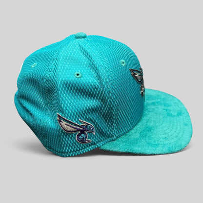Raree Finds Charlotte Hornets New Era 9FIFTY snapback hat in teal performance fabric with a suede-style brim.