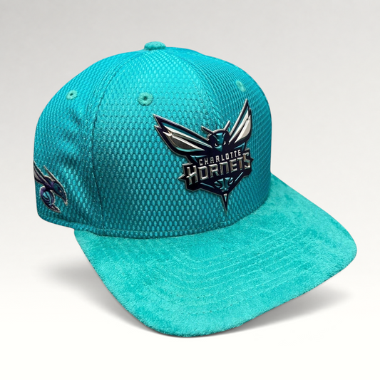 Raree Finds Charlotte Hornets New Era 9FIFTY snapback hat in teal with a raised rubberized logo and suede-style brim.