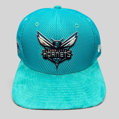 Raree Finds Charlotte Hornets New Era 9FIFTY snapback hat in teal with a raised rubberized team logo and suede brim.