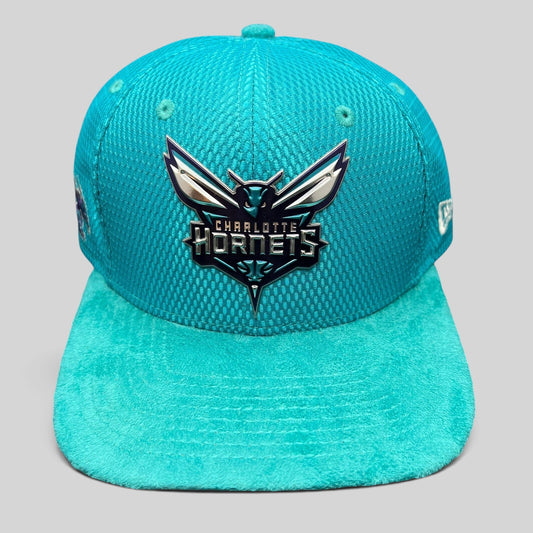 Raree Finds Charlotte Hornets New Era 9FIFTY snapback hat in teal with a raised rubberized team logo and suede brim.