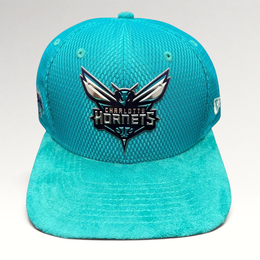Raree Finds Charlotte Hornets New Era 9FIFTY snapback hat in teal with a raised rubberized team logo and suede brim.