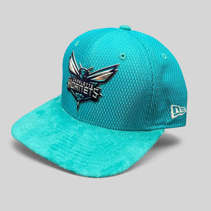 Raree Finds Charlotte Hornets New Era 9FIFTY snapback hat in teal with a textured crown and suede-style brim.