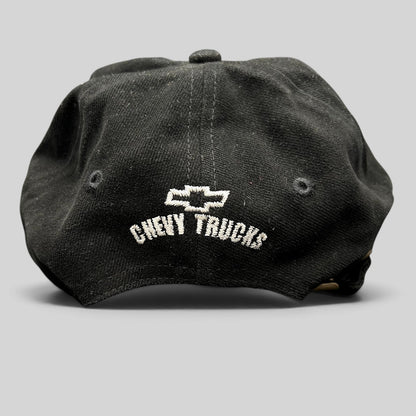 Raree Finds vintage black cotton strapback hat featuring white embroidered Chevy Trucks logo on the back panel.