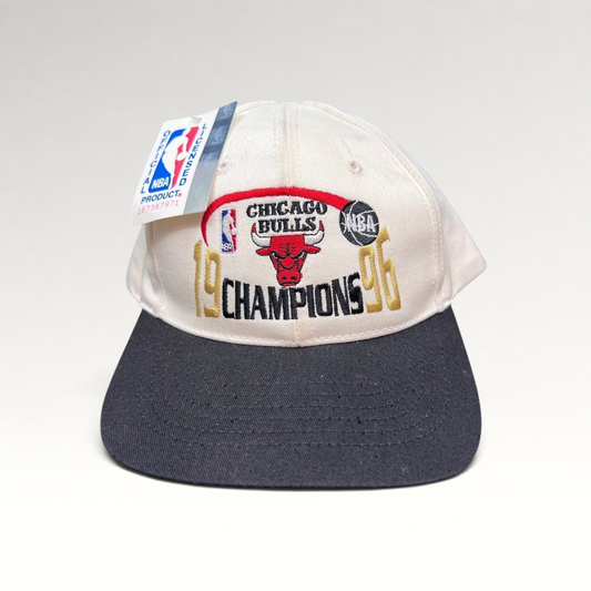 Raree Finds vintage 1996 Chicago Bulls NBA Champions snapback hat with cream crown, black brim, and embroidered logo.