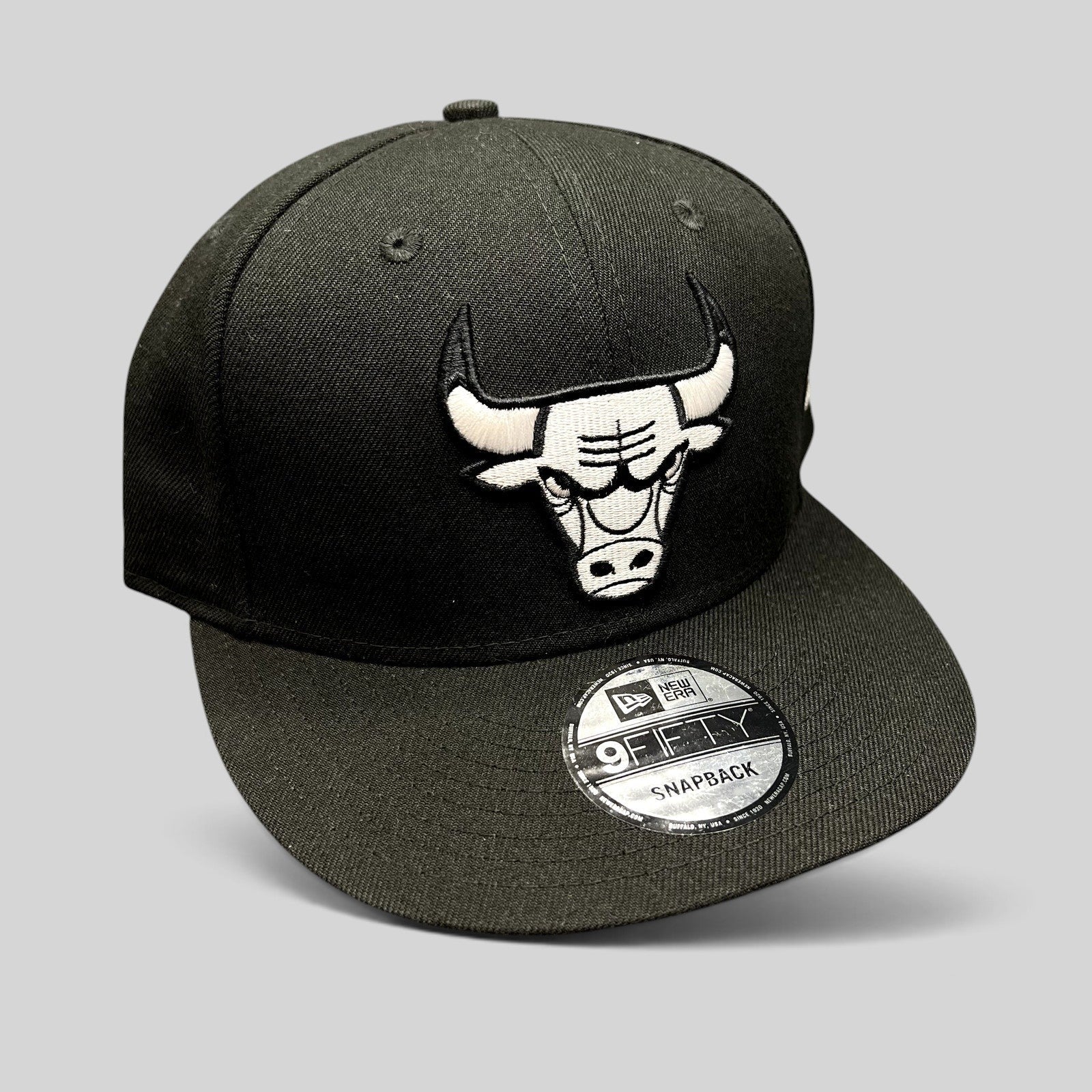 Raree Finds Chicago Bulls blackout 9FIFTY snapback hat with raised white embroidered logo on a black polyester crown