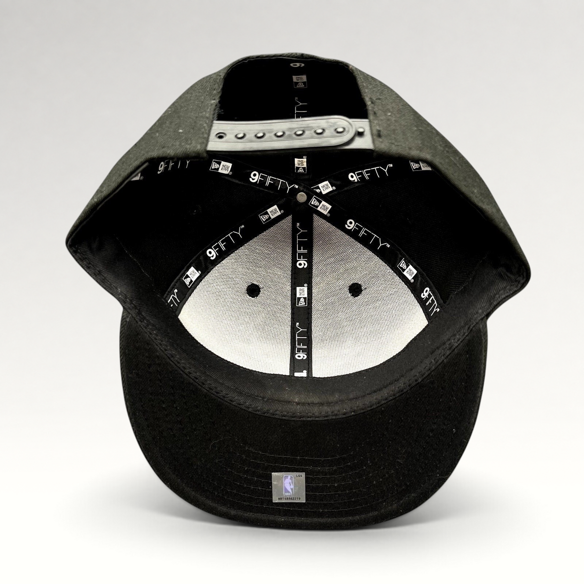 Raree Finds Chicago Bulls New Era 9FIFTY snapback hat interior view showing branded taping and adjustable strap