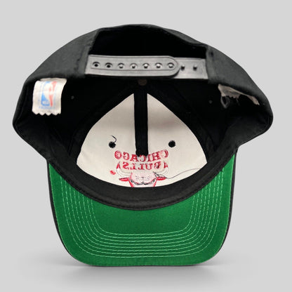 Raree Finds vintage 90s Chicago Bulls snapback hat with black crown, green under-visor, and interior NBA logo tag.