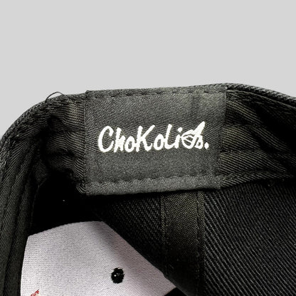 Raree Finds black Chokolids snapback hat interior label detail showing white embroidered brand logo