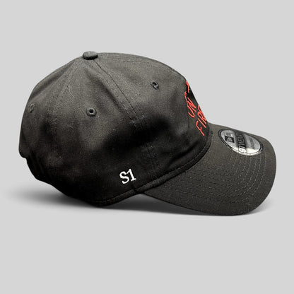 Raree Finds City On Fire season 1 black cotton New Era 9TWENTY strapback hat with red embroidery and S1 side detail.