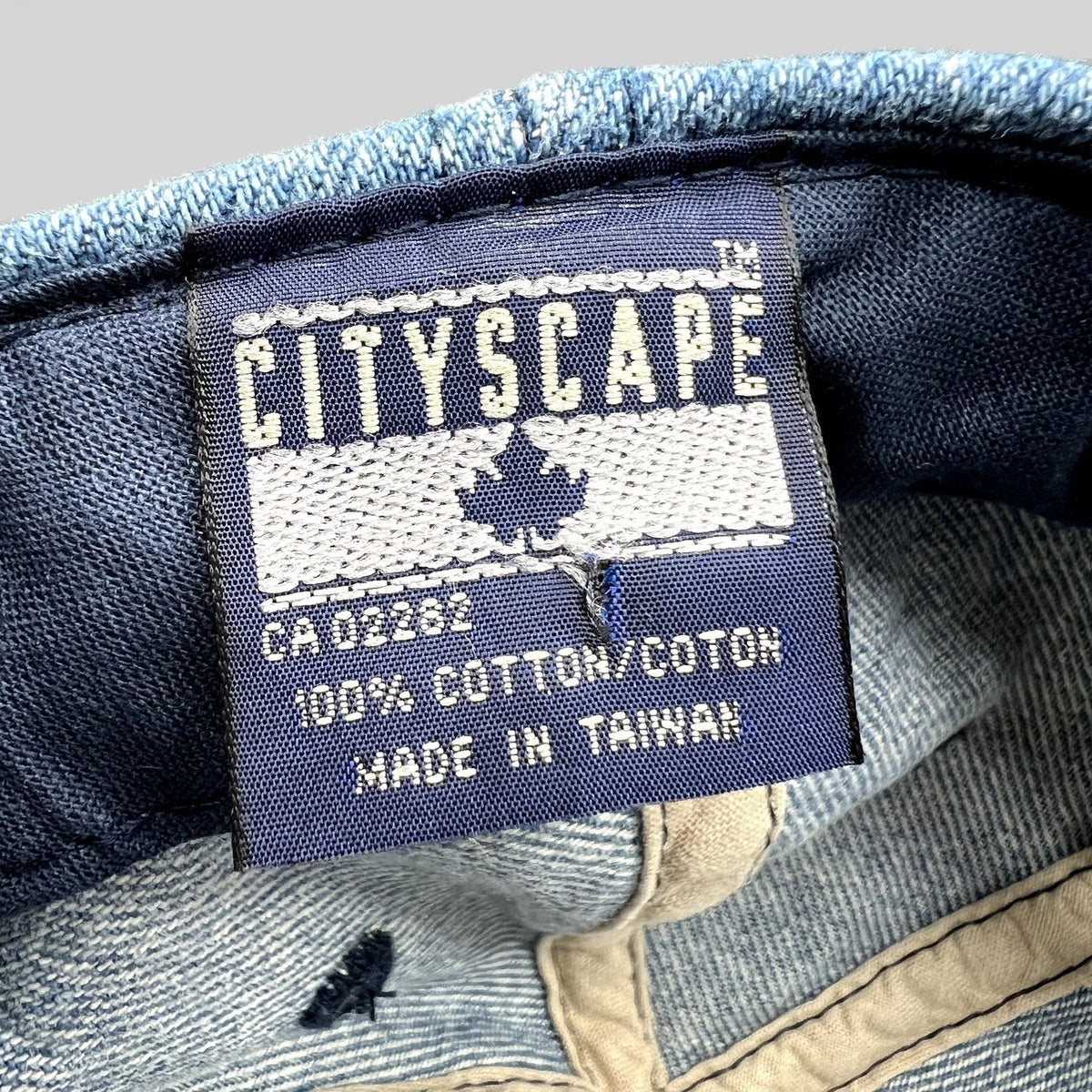 Raree Finds vintage Cityscape hat interior label showing 100 percent cotton material and made in Taiwan text