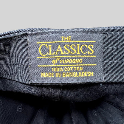 Raree Finds black cotton Classics by Yupoong hat interior label with yellow embroidery