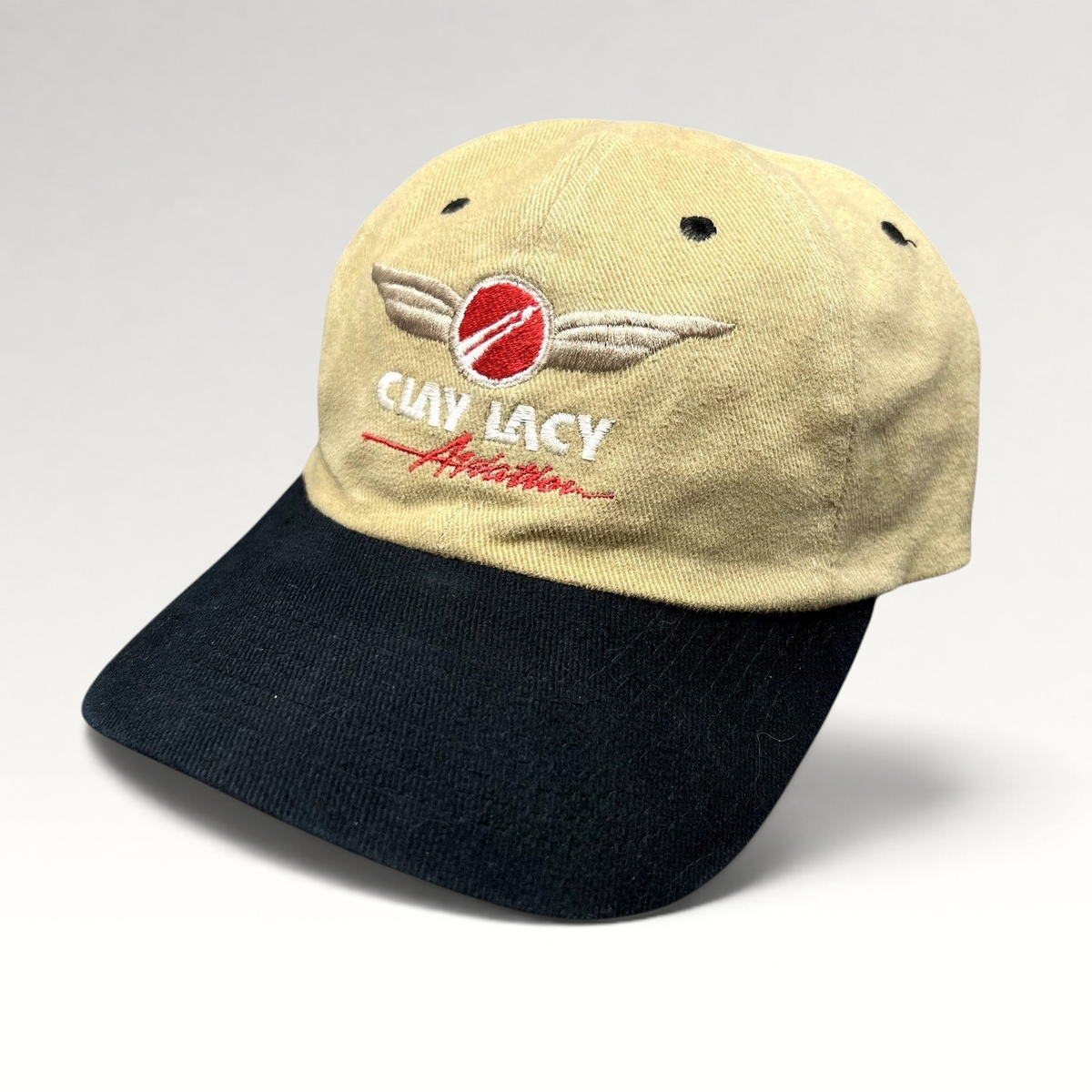 Raree Finds vintage Clay Lacy Aviation cap with tan cotton crown, black brim, and embroidered winged pilot logo.