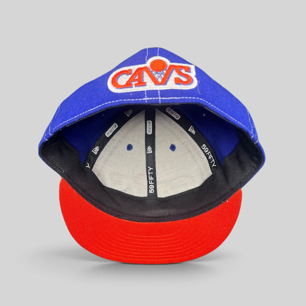 Raree Finds vintage New Era 59FIFTY Cleveland Cavaliers fitted hat with royal blue crown and orange brim