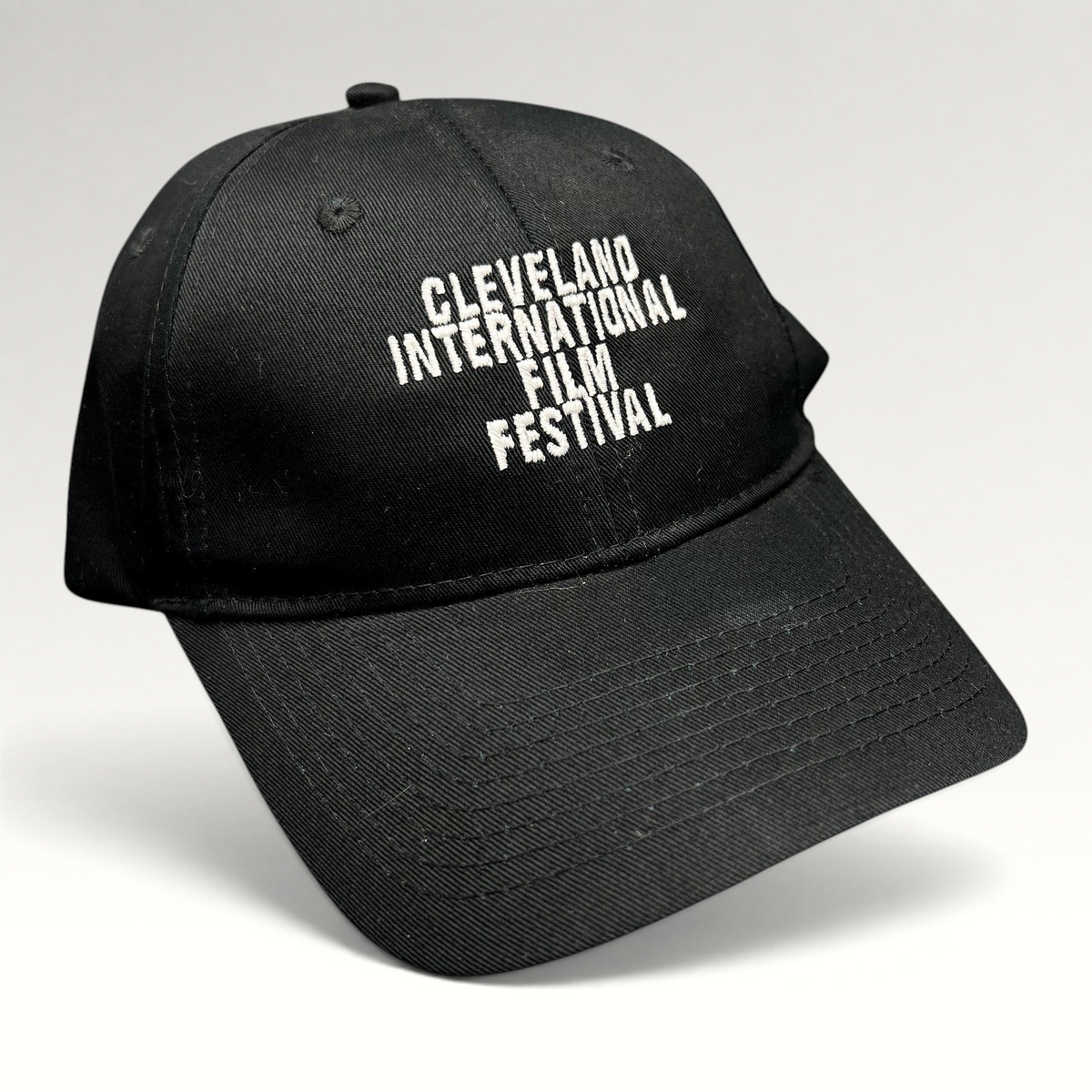 Raree Finds black strapback hat with white embroidered Cleveland International Film Festival lettering on the front