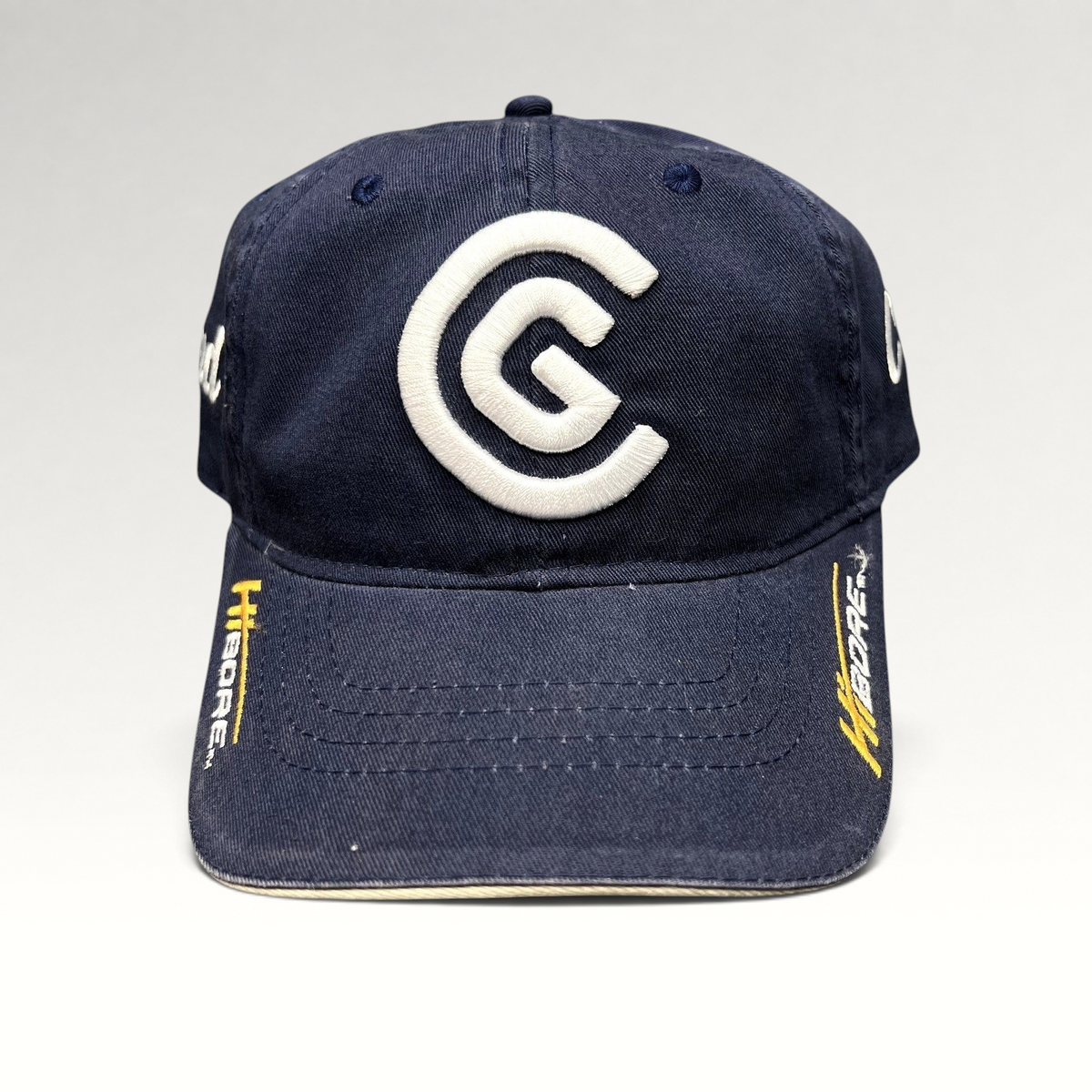 Raree Finds navy blue cotton twill Cleveland Golf strapback hat with white embroidered CG logo and HiBore brim detail