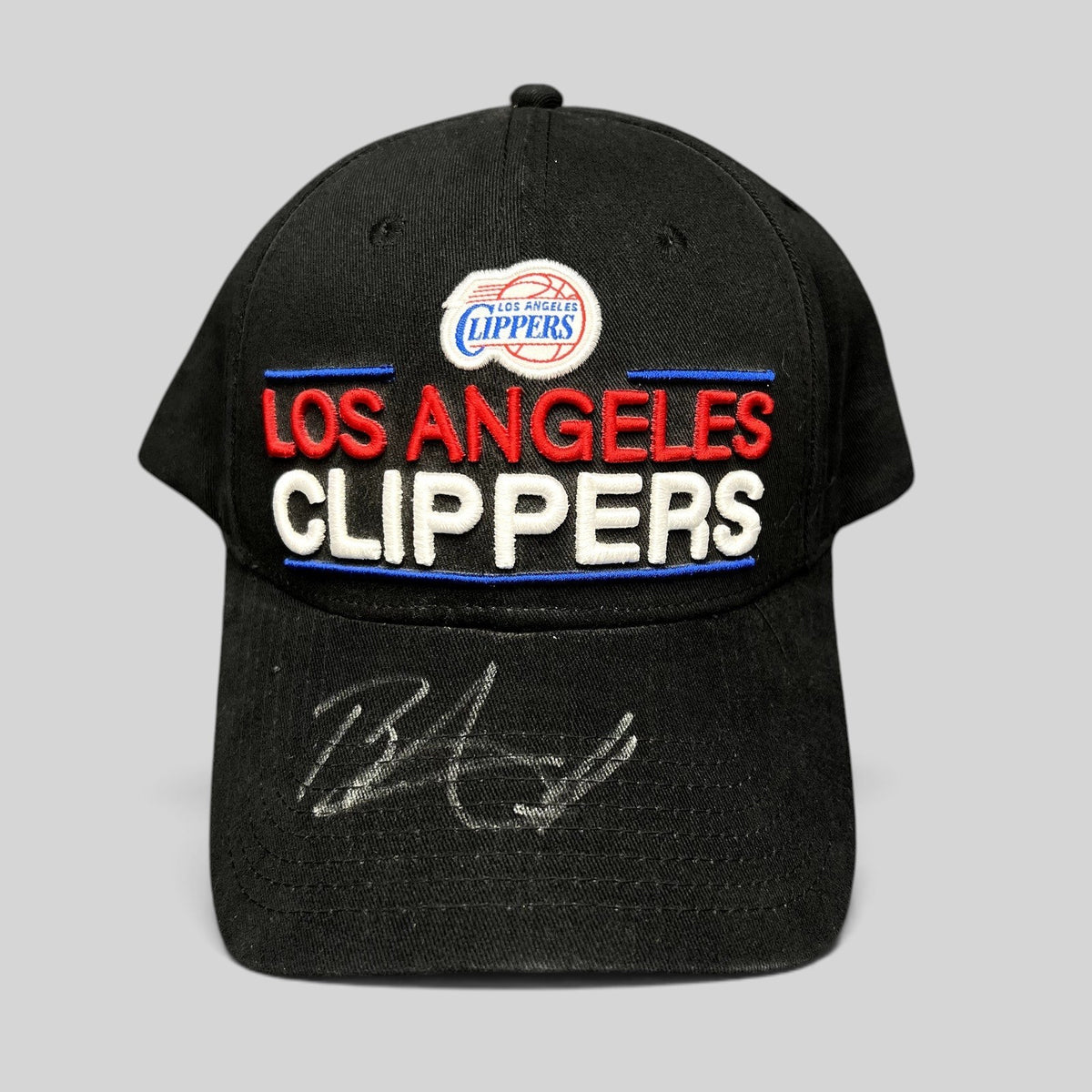 Raree Finds vintage Los Angeles Clippers black cotton strapback hat with embroidered team logo and signed brim.