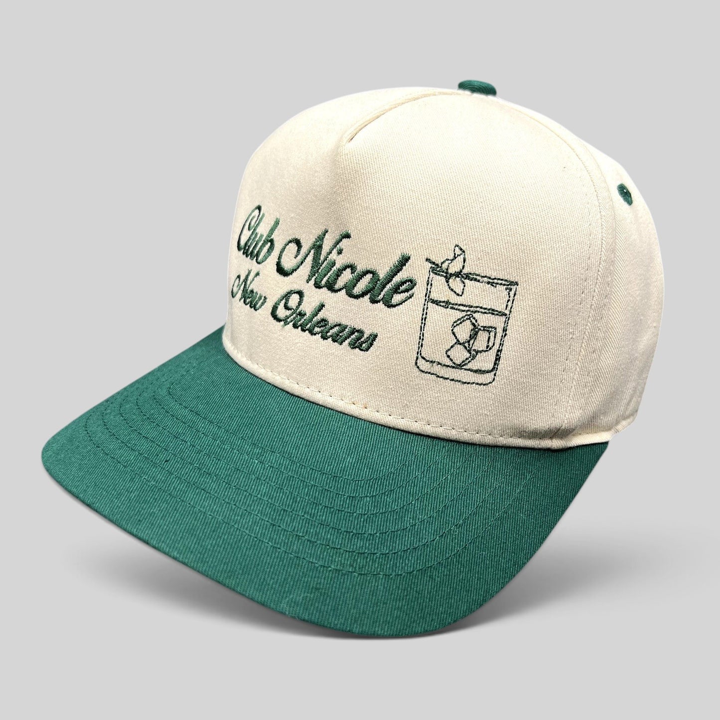 Raree Finds vintage Club Nicole New Orleans snapback hat with cream crown, green brim, and embroidered cocktail logo.