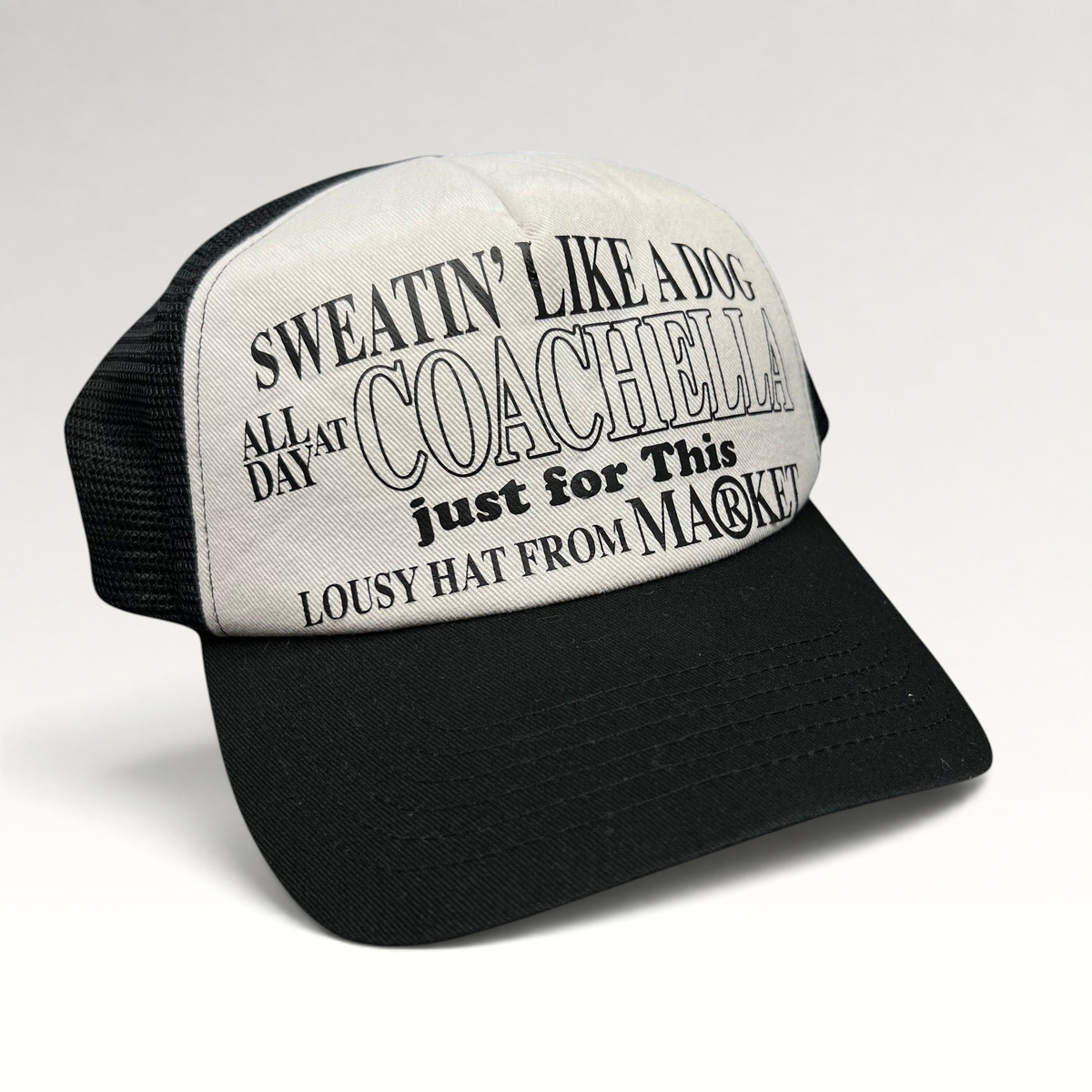 Raree Finds black and white Coachella x Market trucker hat with Sweatin Like a Dog graphic on foam front mesh back
