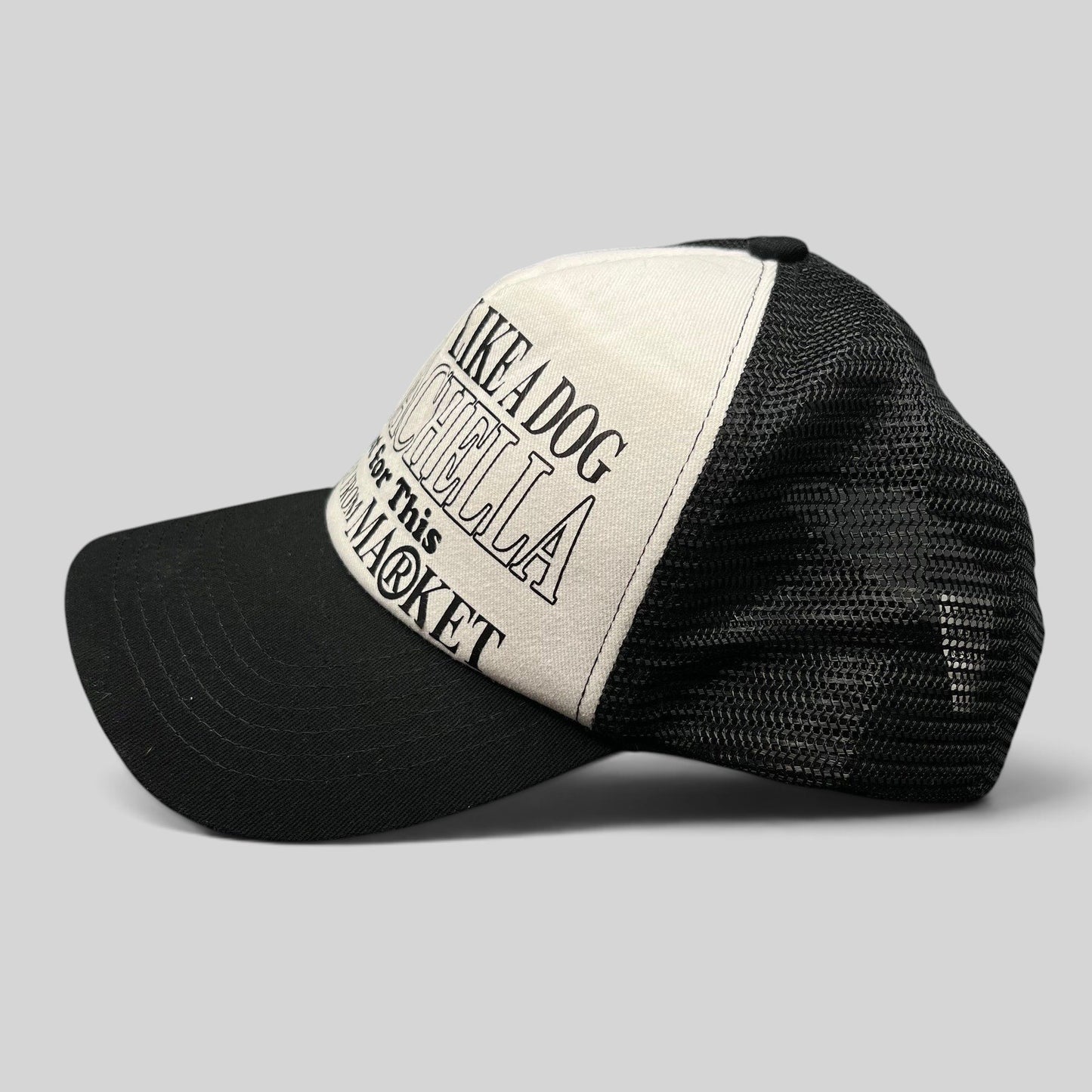 Raree Finds Coachella x Market black and white trucker hat with foam front and mesh back featuring graphic text