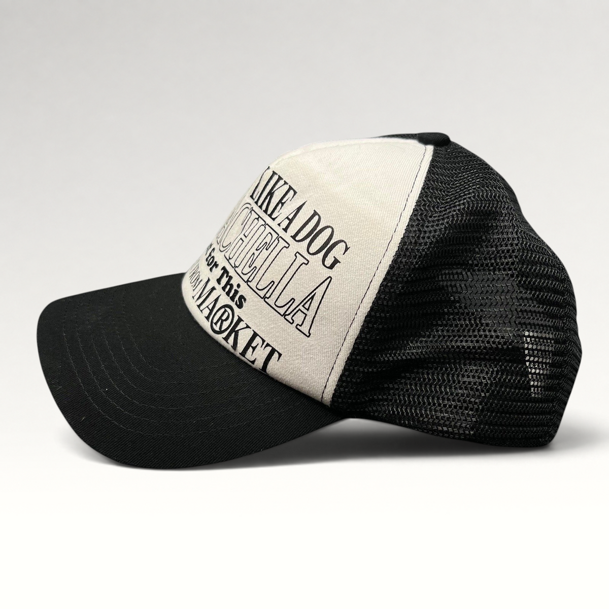 Raree Finds Coachella x Market black and white trucker hat with foam front and mesh back featuring graphic text