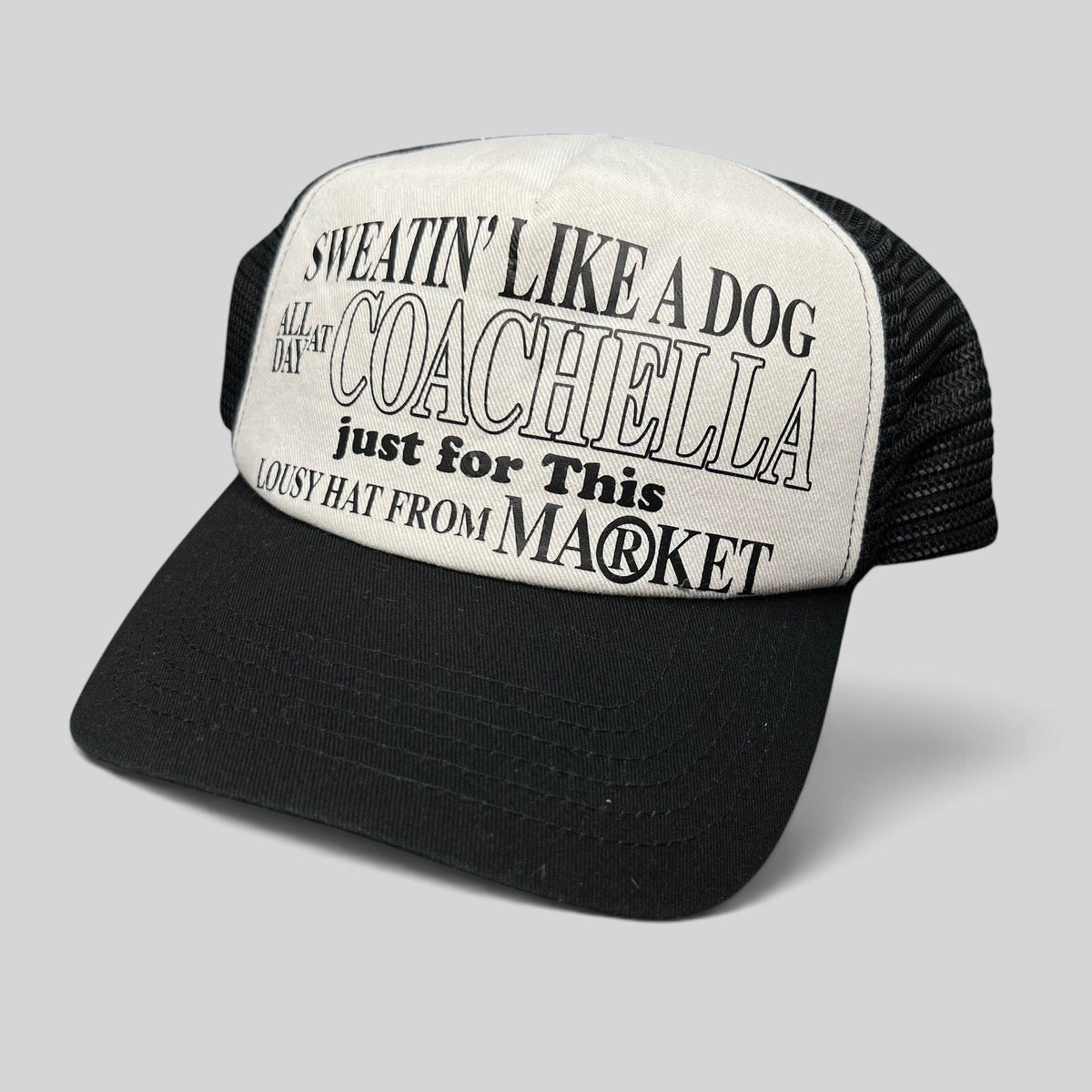 Raree Finds Coachella x Market black and white foam trucker hat with graphic text on the front panel
