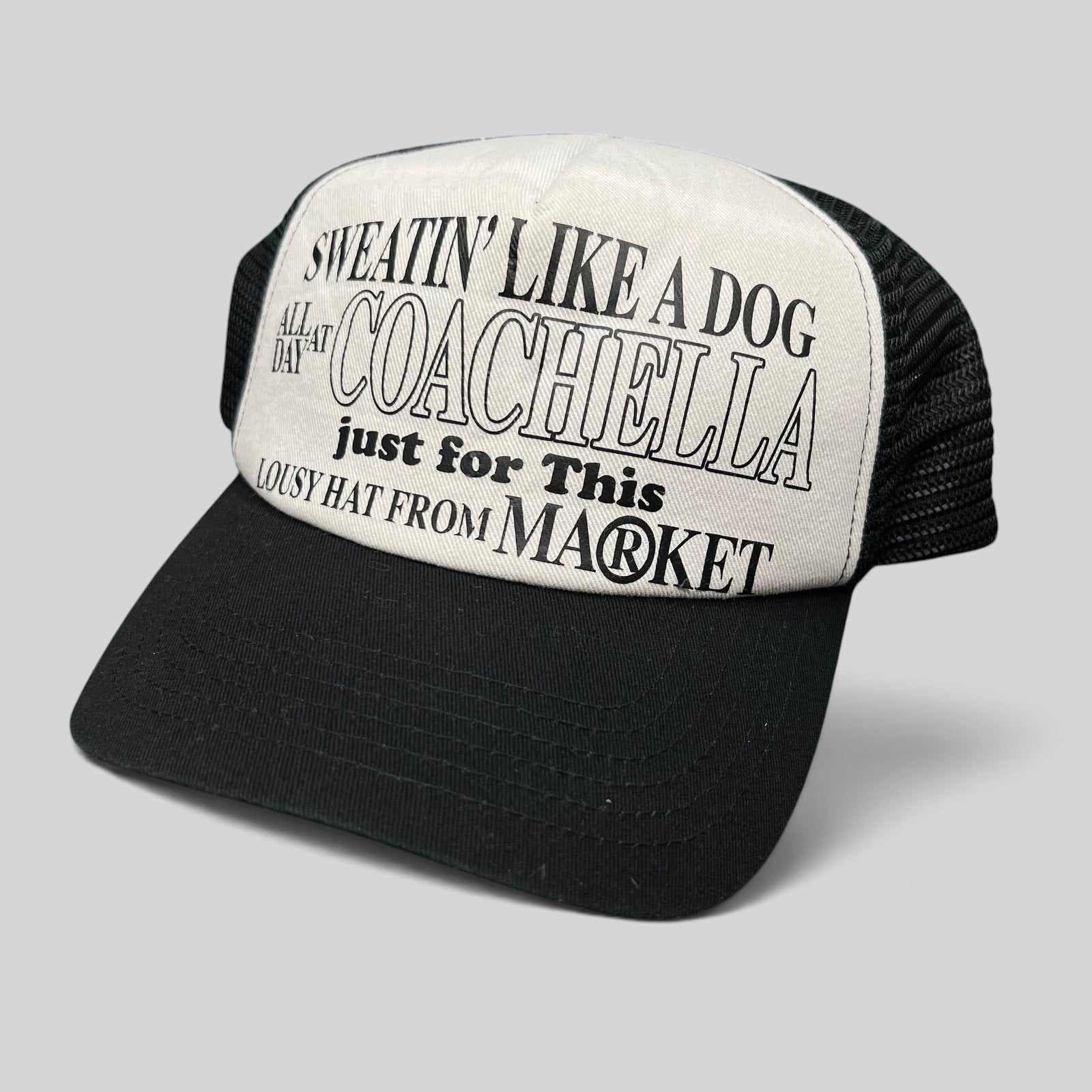 Raree Finds Coachella x Market black and white foam trucker hat with graphic text on the front panel