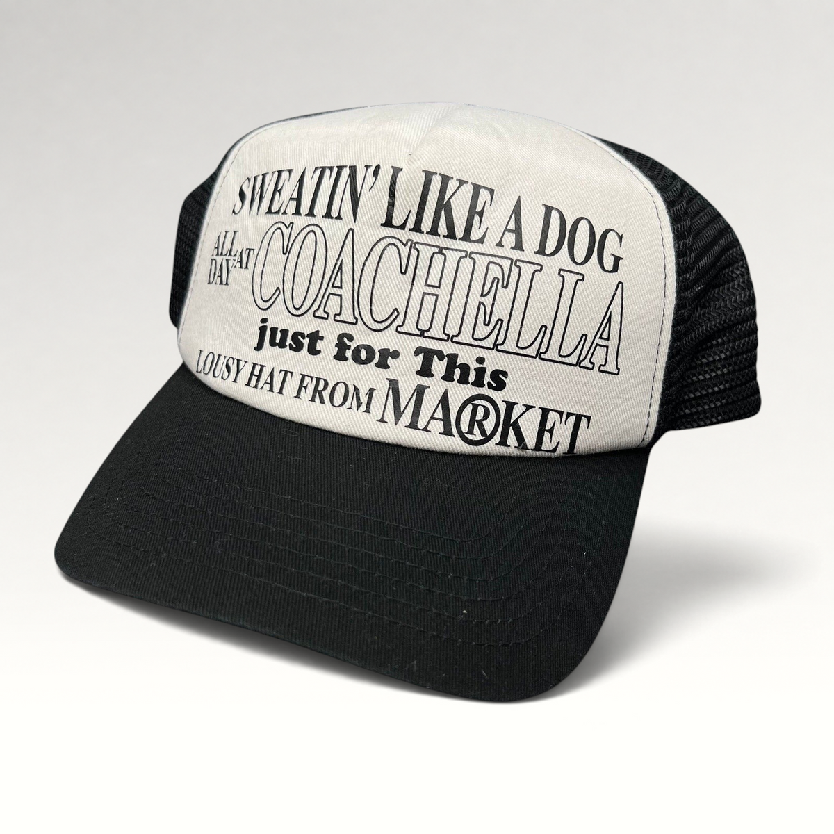 Raree Finds Coachella x Market black and white foam trucker hat with graphic text on the front panel