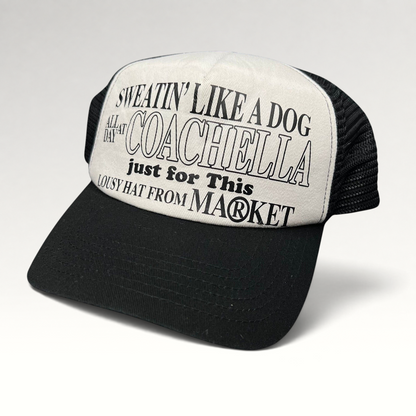 Raree Finds Coachella x Market black and white foam trucker hat with graphic text on the front panel