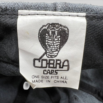 Raree Finds vintage 1998 Cobra Caps hat interior label showing brand logo and manufacturing details