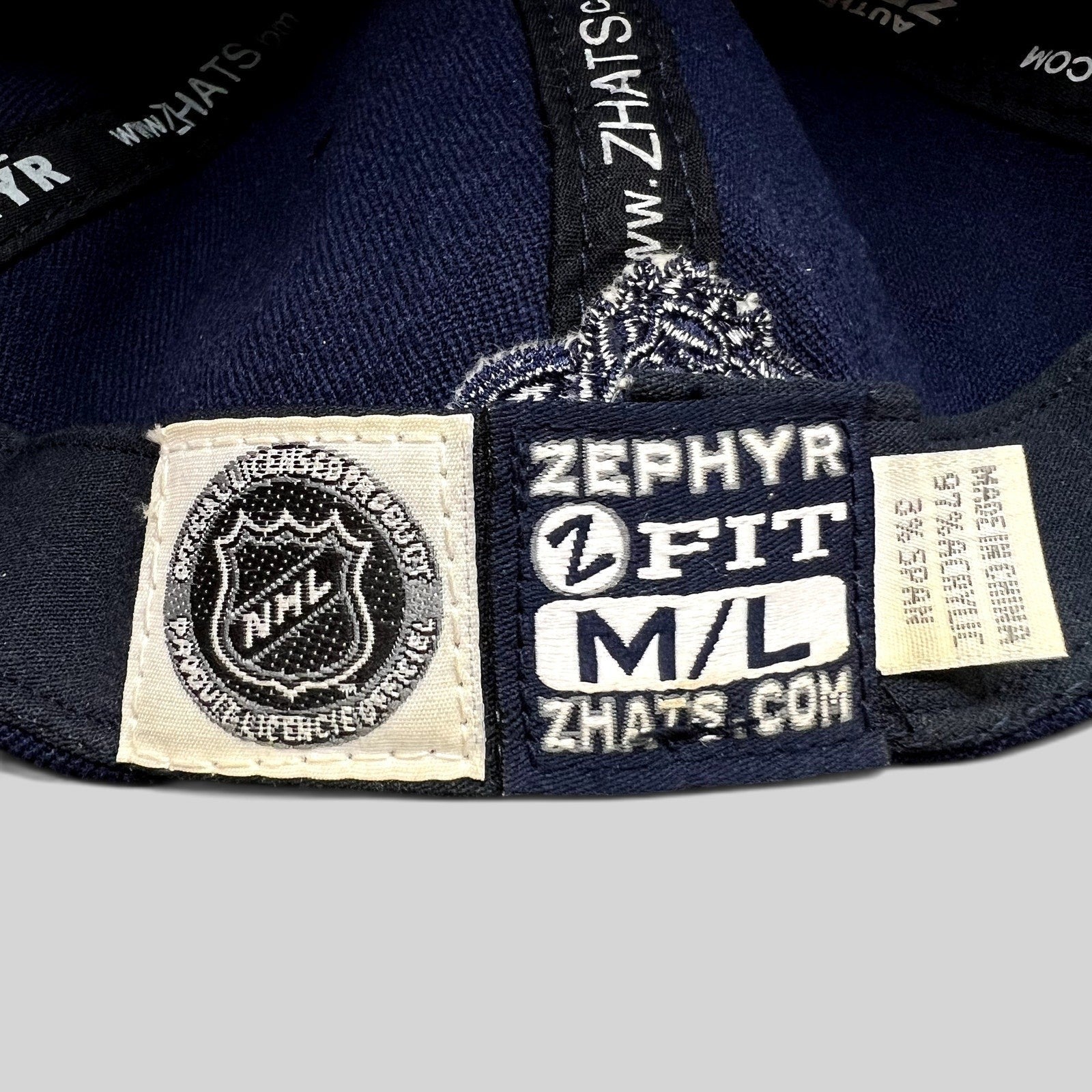 Raree Finds Colorado Avalanche Zephyr Z-Fit hat interior label showing NHL branding and size M/L tag