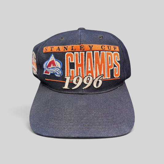 Raree Finds vintage 1996 Colorado Avalanche navy blue cotton snapback hat with Stanley Cup Champions embroidery.
