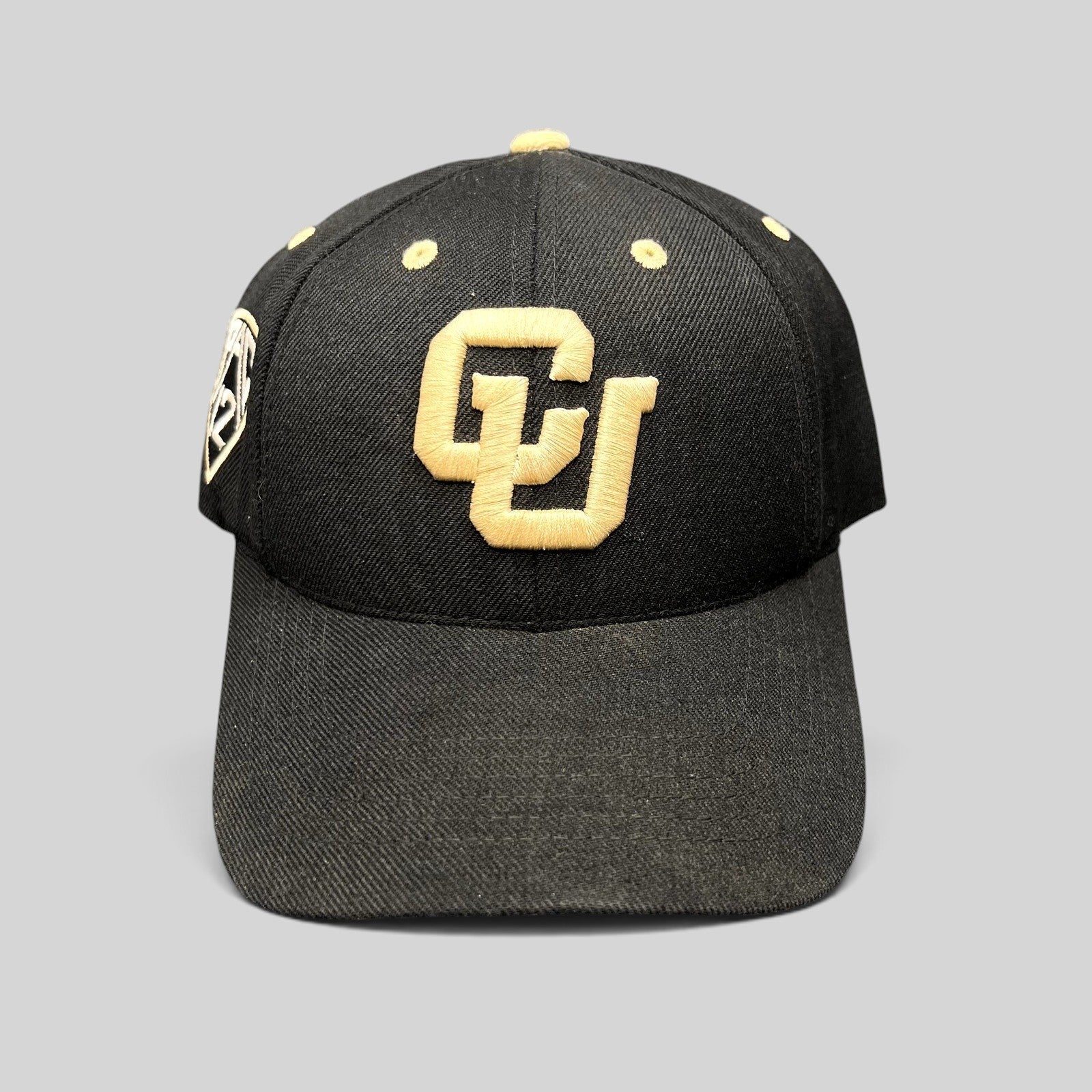 Raree Finds Colorado Buffaloes black strapback hat with raised metallic gold CU logo embroidery and side patch.