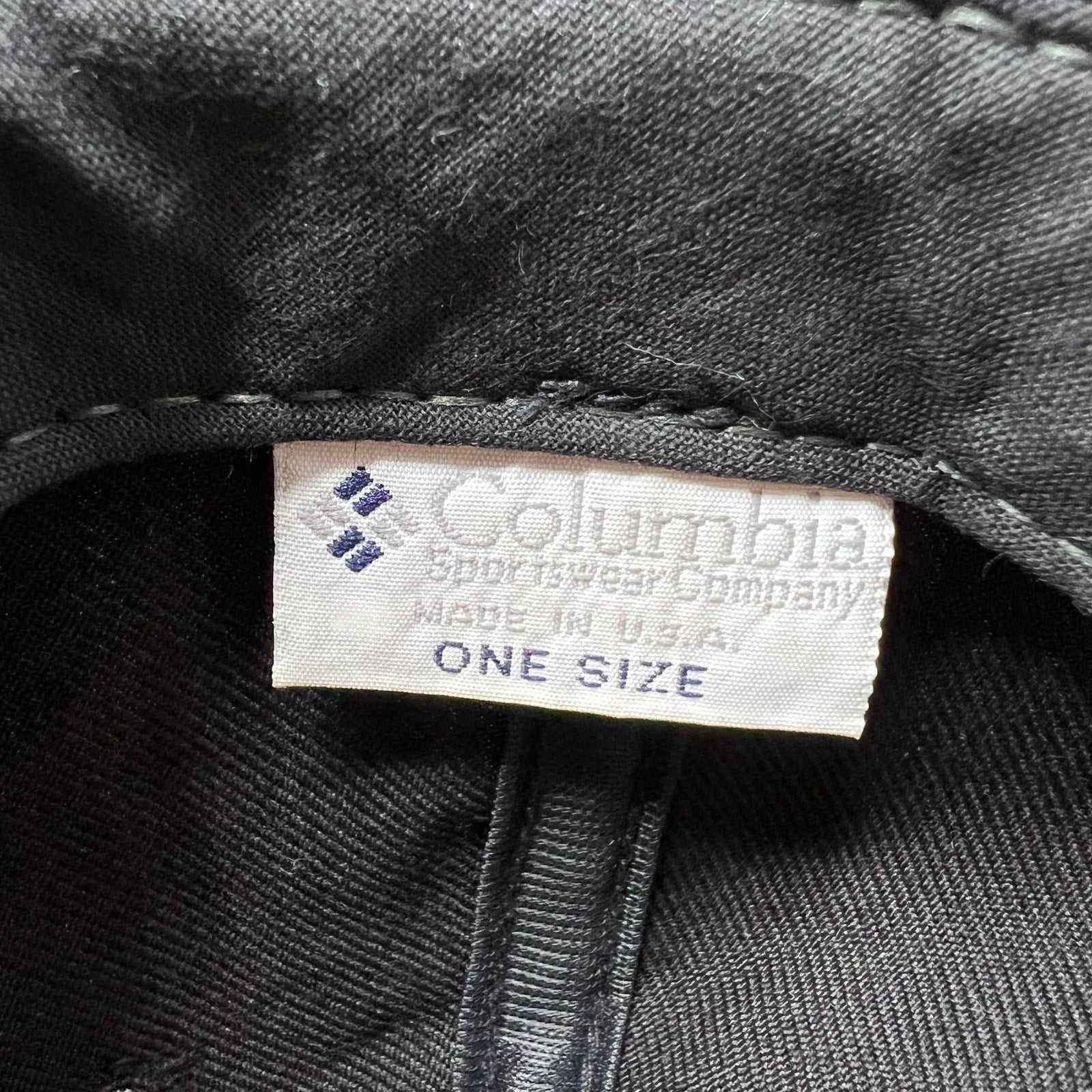 Raree Finds vintage Columbia Sportswear snapback hat interior tag showing Made in U.S.A. branding and one size label.
