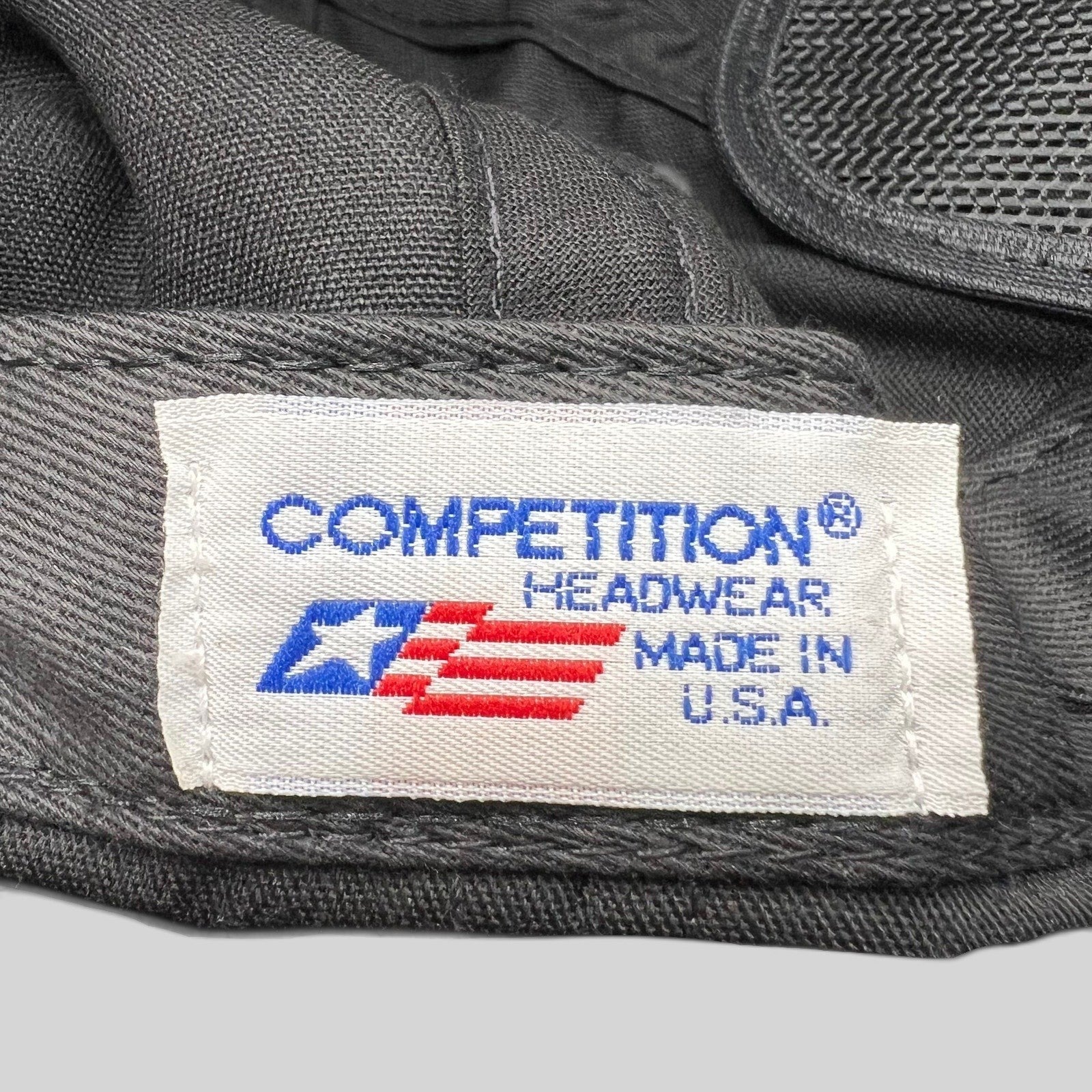 Raree Finds vintage Competitor Headwear label stitched inside a black racing snapback hat made in the USA