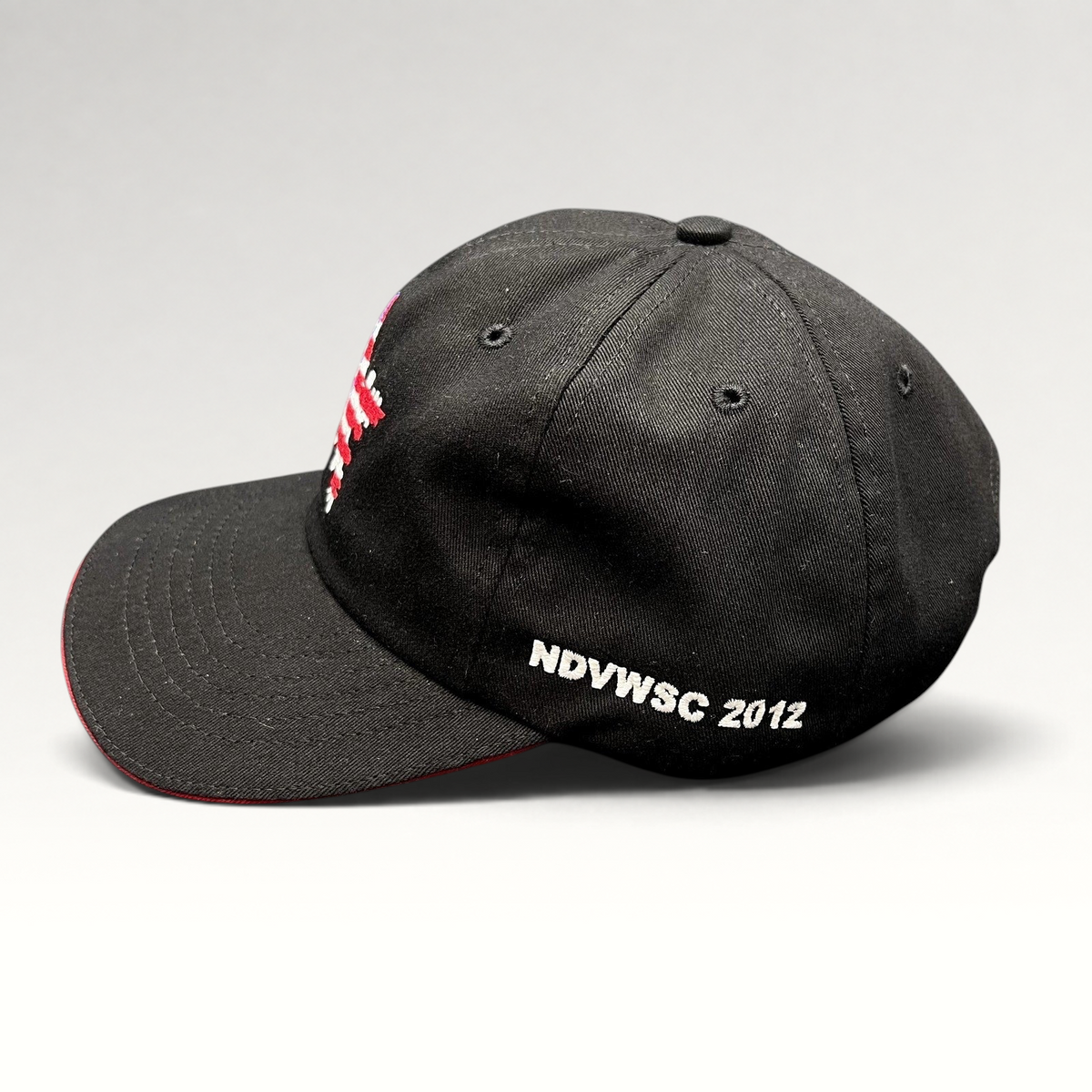 Raree Finds Corps Classics black strapback hat with red sandwich brim and NDVWSC 2012 side embroidery