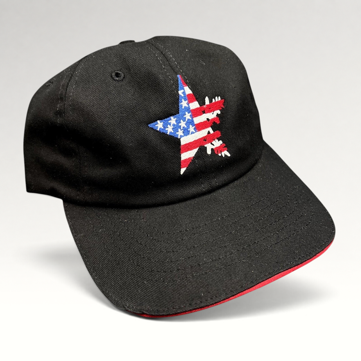 Raree Finds Corps Classics black strapback hat with an embroidered American flag star and red sandwich brim.